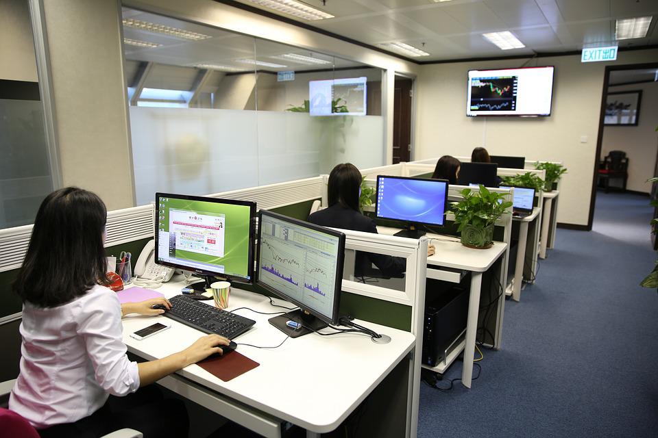 coworkers working in office