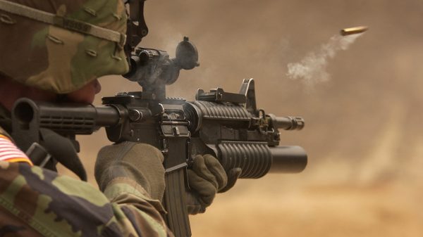 Soldier Holding Rifle and taking shoot